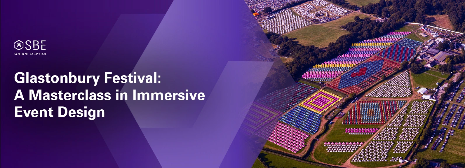 Aerial view of Glastonbury Festival at Worthy Farm showing thousands of festivalgoers, illuminated stages, and the temporary city built across the Somerset countryside.